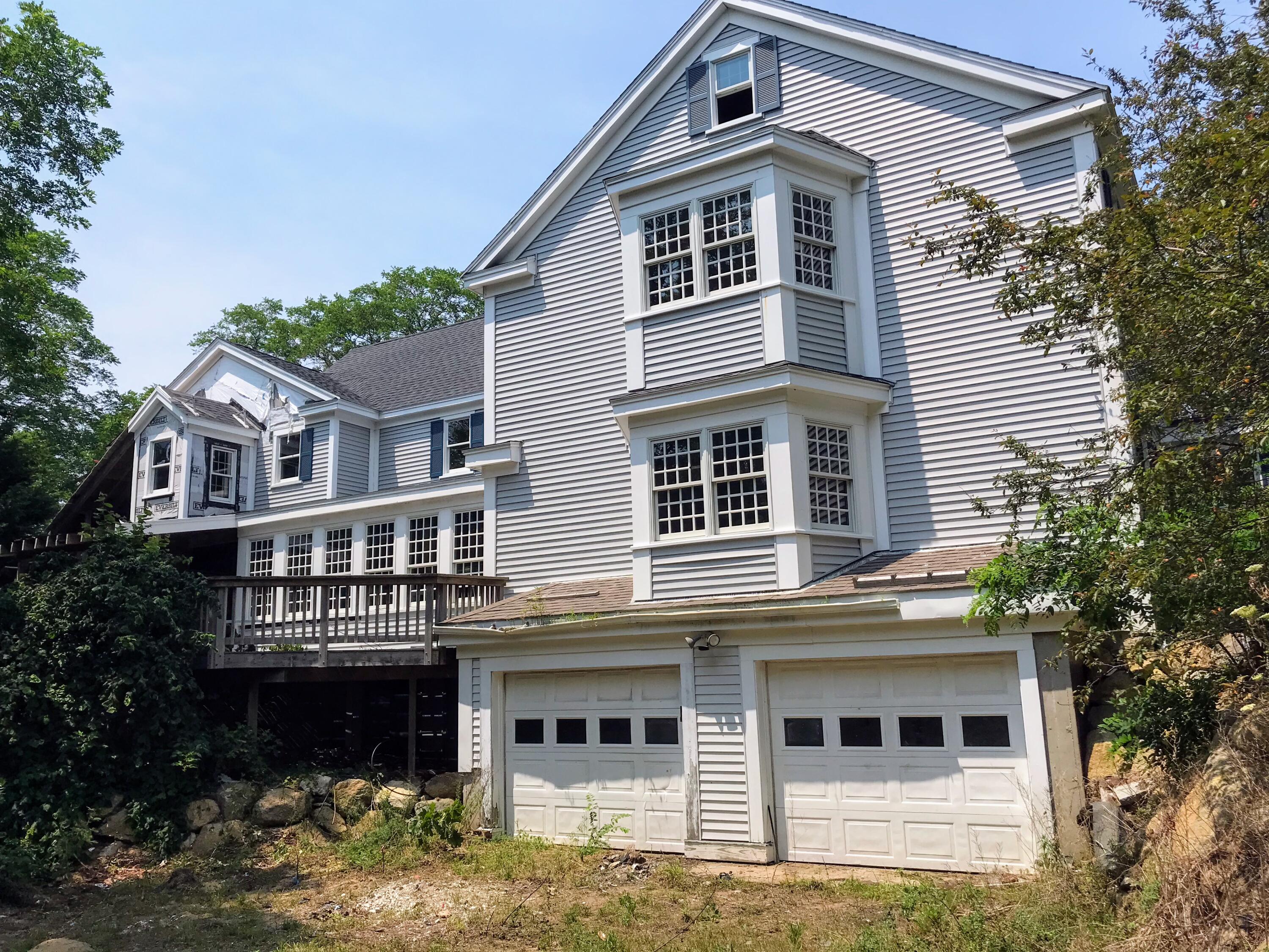 105 Townsend Avenue Eastham, MA 02642 - Photo 5 of 16 a front view of a house with balcony