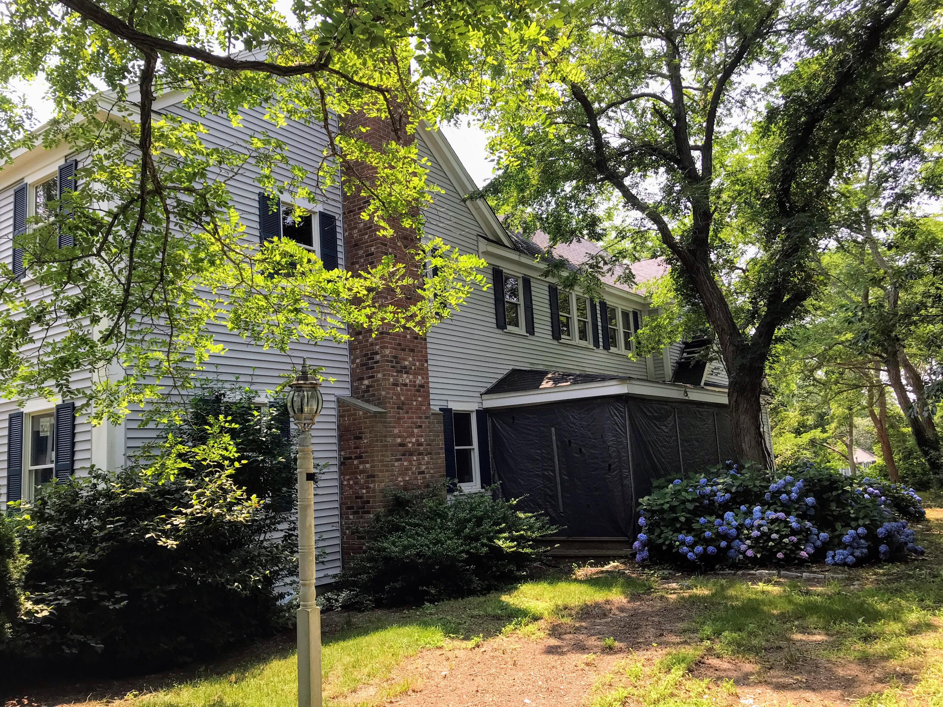 105 Townsend Avenue Eastham, MA 02642 - Photo 9 of 16 a view of house with swimming pool and garden