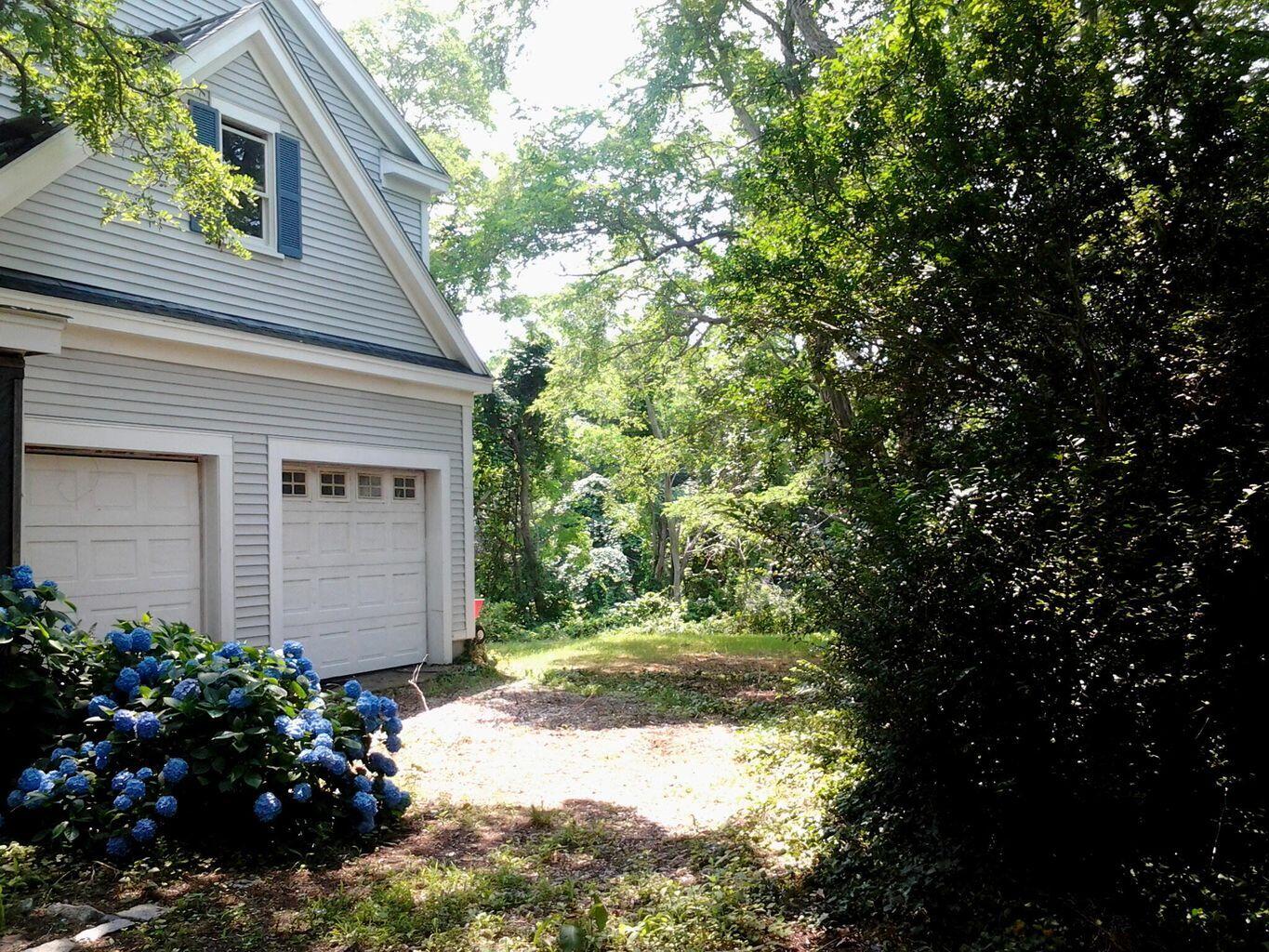 105 Townsend Avenue Eastham, MA 02642 - Photo 10 of 16 a view of a house with a flower garden