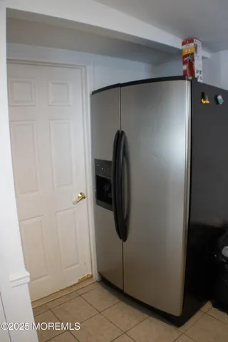 a view of a storage & utility room with a washer dryer