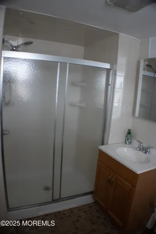 a bathroom with a sink and mirror