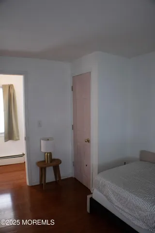 a bedroom with a bed and a table in it