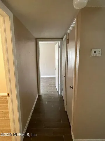 a view of hallway with windows