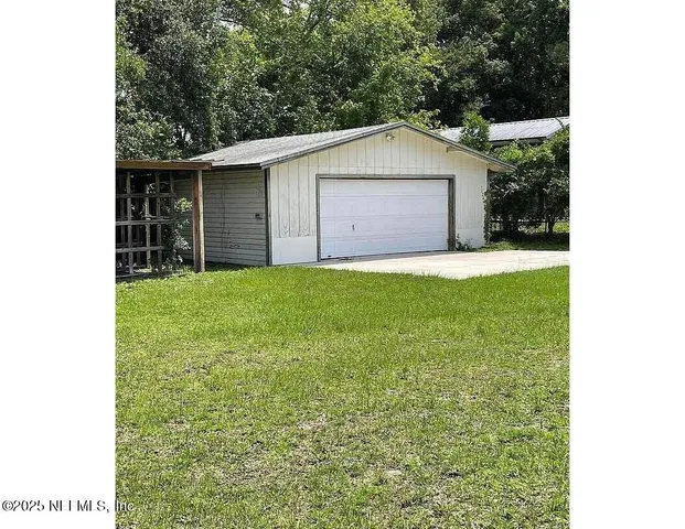 a house view with a garden space