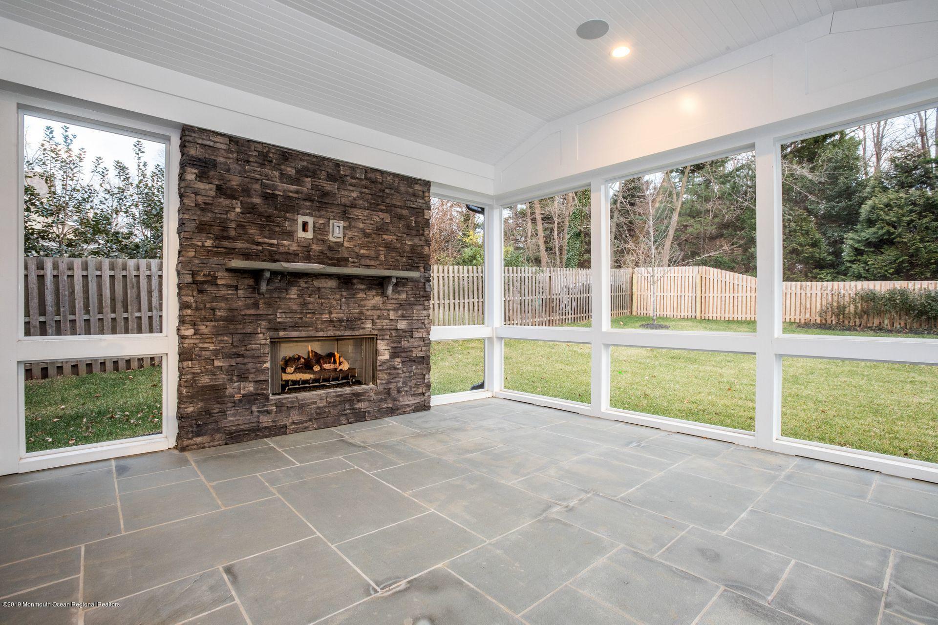 26 Hillcrest Road Fair Haven, NJ 07704 - Photo 18 of 46 Screen porch w/FP & TV hook-up