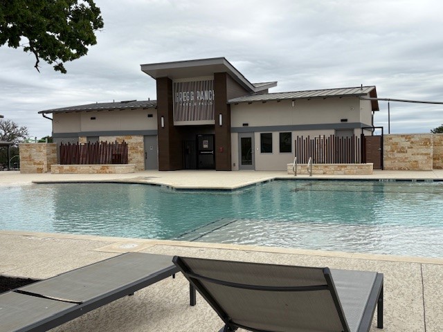 221 Firethorn Road Marble Falls, TX 78654 - Photo 19 of 21 Community pool with a balcony and a patio