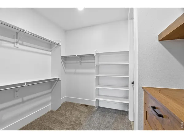 a view of an empty walk in closet