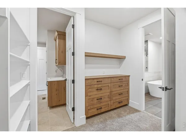 a bathroom with a sink a mirror and a toilet