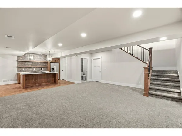 a view of an empty room with stairs