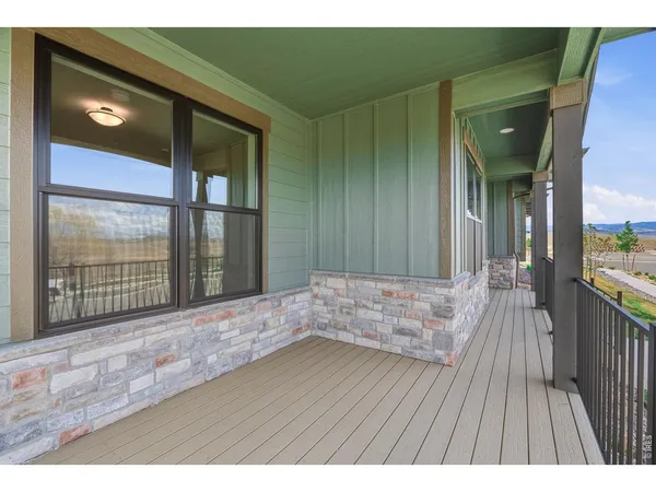 a bedroom with a bed and a flat tv screen on dresser
