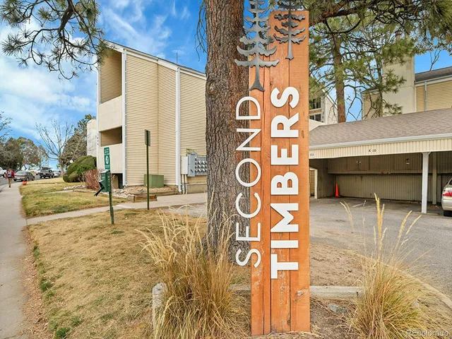 a view of a street sign on a sidewalk
