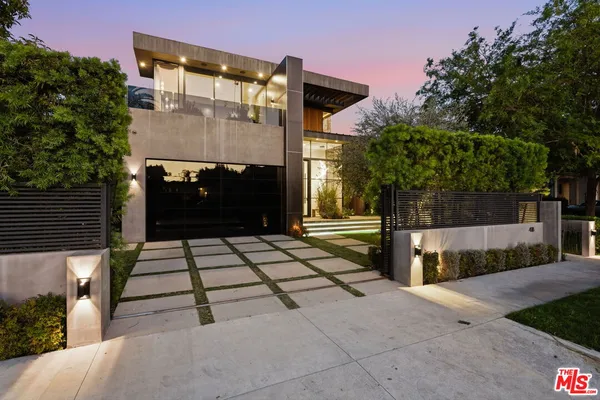 a front view of a house with a garage