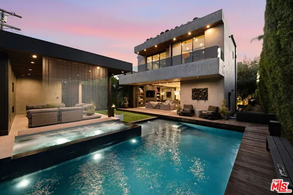 a view of a swimming pool with a patio