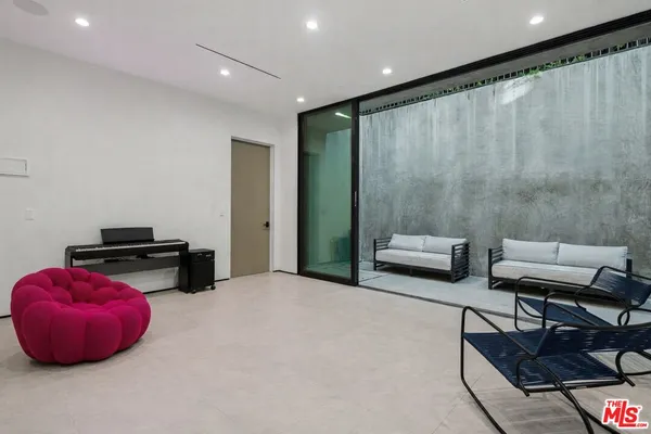a bedroom with furniture and a rug