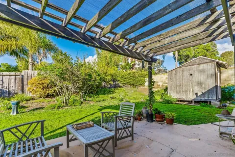 a view of yard with patio