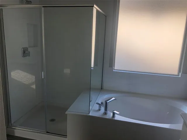 a kitchen with kitchen island granite countertop a sink and a stove top oven