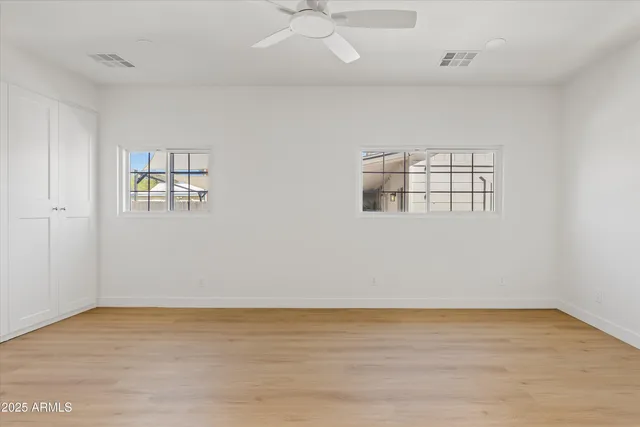 a kitchen with a sink a refrigerator and cabinets