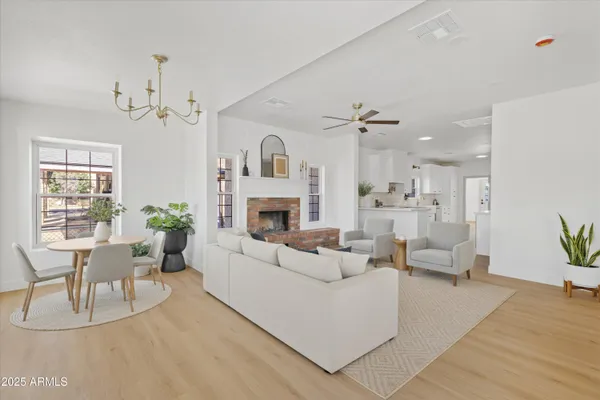 a dining room with furniture and wooden floor
