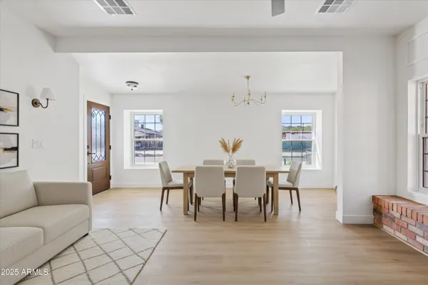 a kitchen with white cabinets and a stove