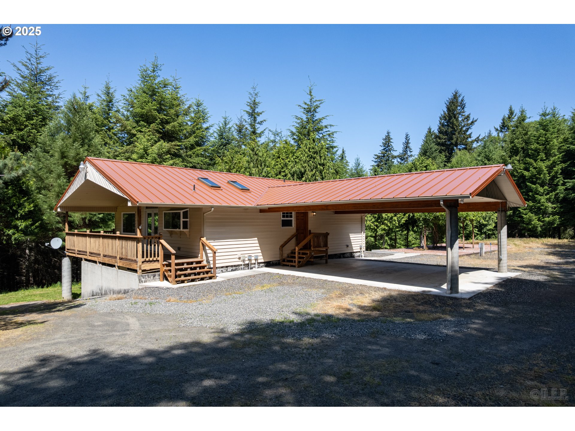 25363 Wonderly Road Rainier, OR 97048 - Photo 1 of 40 a view of a patio with table and chairs under an umbrella