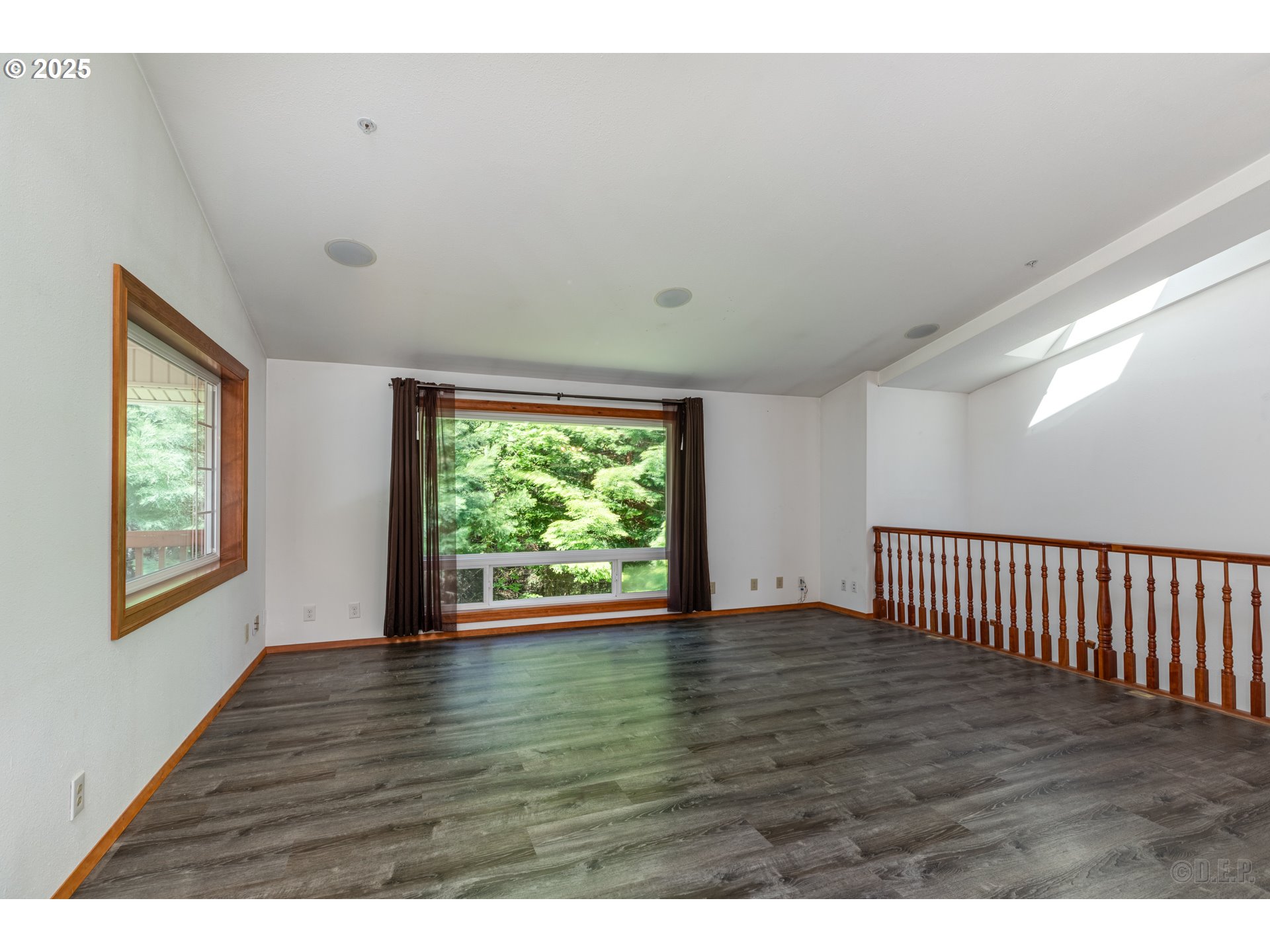 25363 Wonderly Road Rainier, OR 97048 - Photo 7 of 40 a view of an empty room with wooden floor and windows