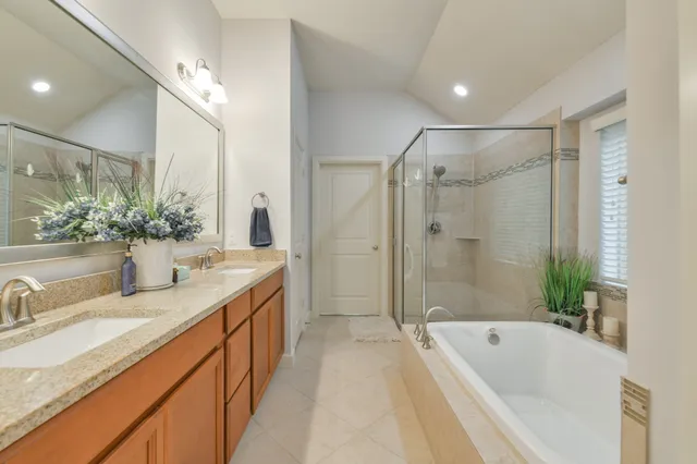 a bathroom with a bathtub and a shower