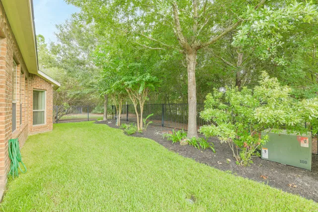 a view of a patio with table and chairs and potted plants