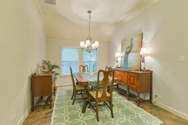a living room with furniture kitchen view and a table
