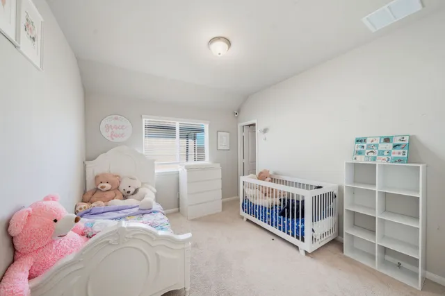 a bedroom with a bed and window