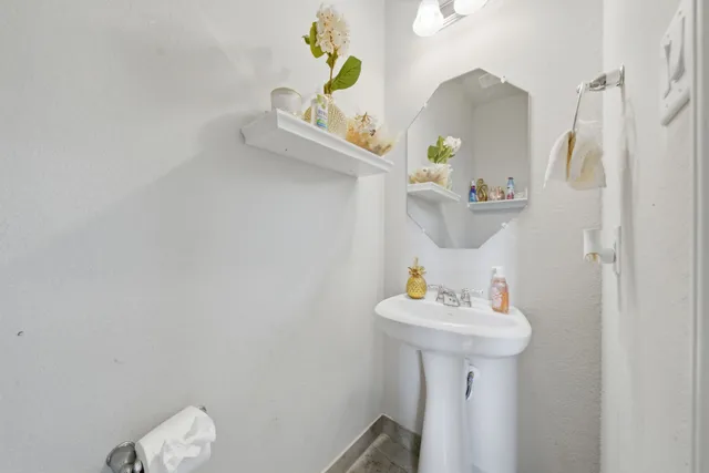 a bathroom with a sink and mirror