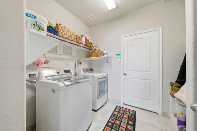 a kitchen with stainless steel appliances kitchen island granite countertop a sink and a stove top oven with wooden floor