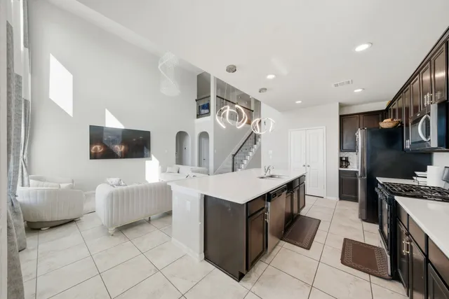a spacious bathroom with a double vanity sink a mirror and a bathtub