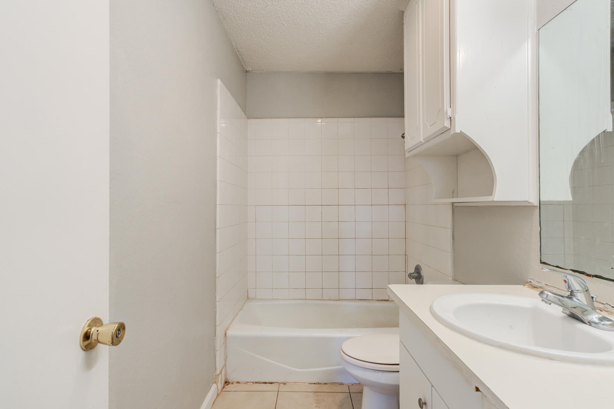 6212 22nd Street Lubbock, TX 79407 - Photo 20 of 24 a bathroom with a toilet a sink and bathtub