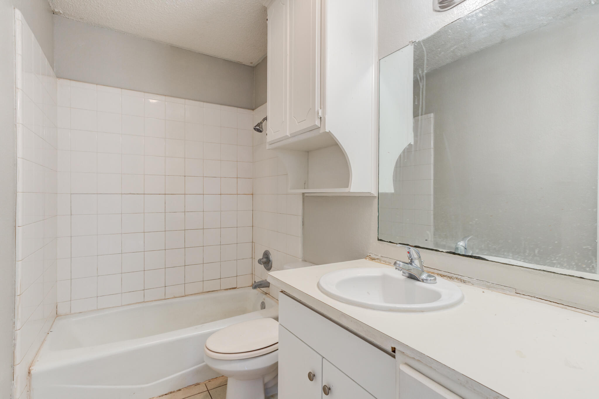 6212 22nd Street Lubbock, TX 79407 - Photo 21 of 24 a bathroom with a sink toilet and shower