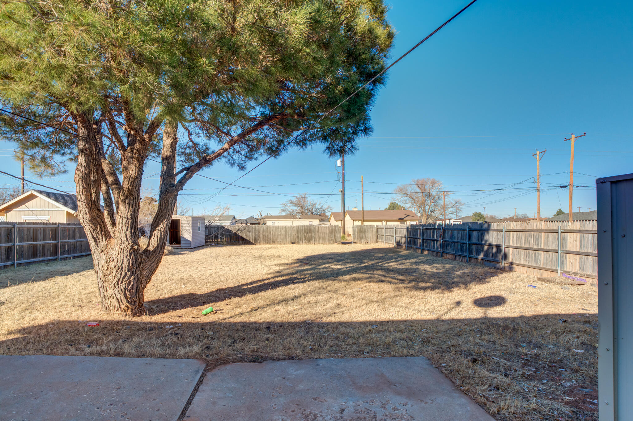 6212 22nd Street Lubbock, TX 79407 - Photo 22 of 24 a view of a yard with a tree