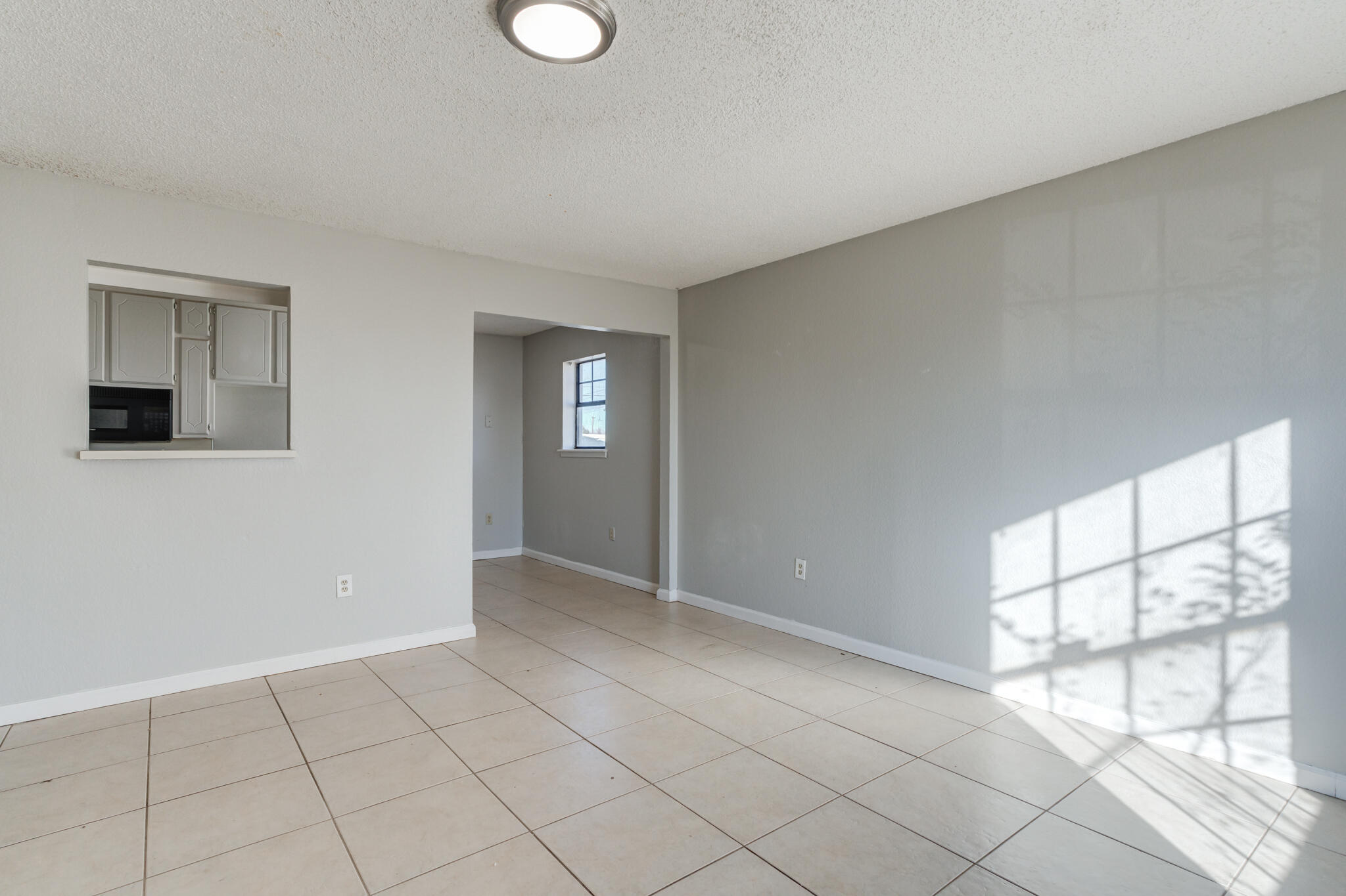 6212 22nd Street Lubbock, TX 79407 - Photo 4 of 24 a view of an empty room and window