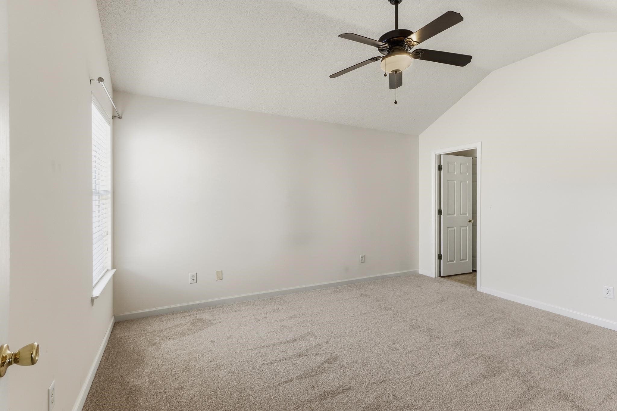 1066 Whitten Road Cordova, TN 38018 - Photo 15 of 30 an empty room with a ceiling fan and a window