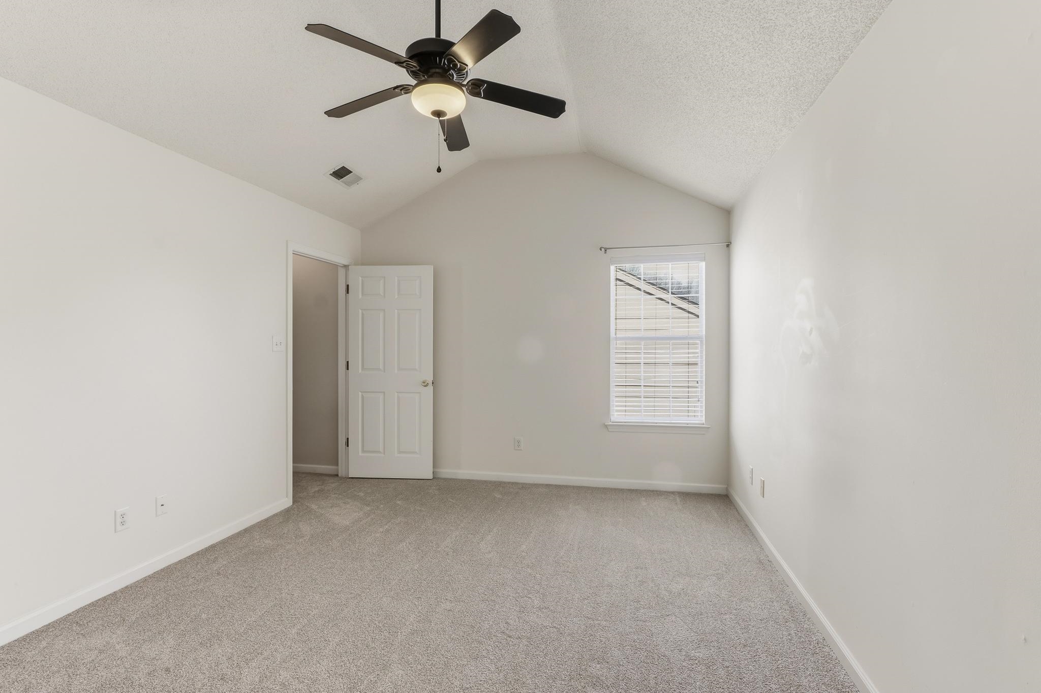 1066 Whitten Road Cordova, TN 38018 - Photo 18 of 30 an empty room with a window and a fan
