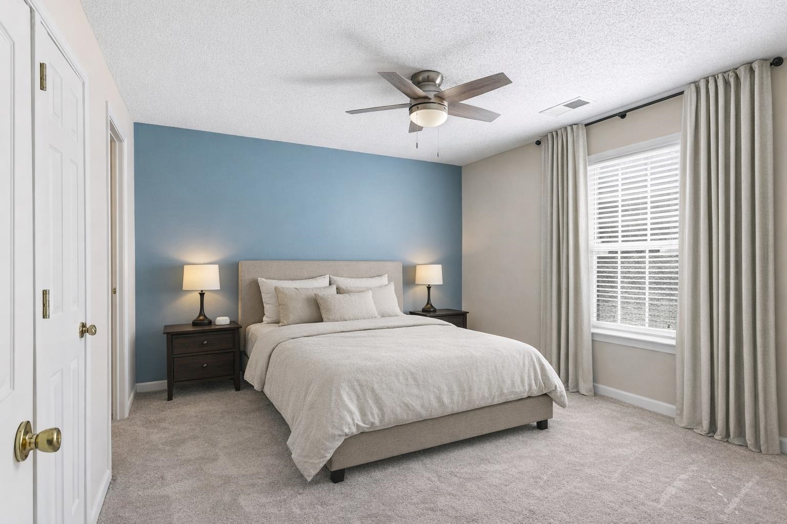 1066 Whitten Road Cordova, TN 38018 - Photo 19 of 30 a bedroom with a bed and a chandelier