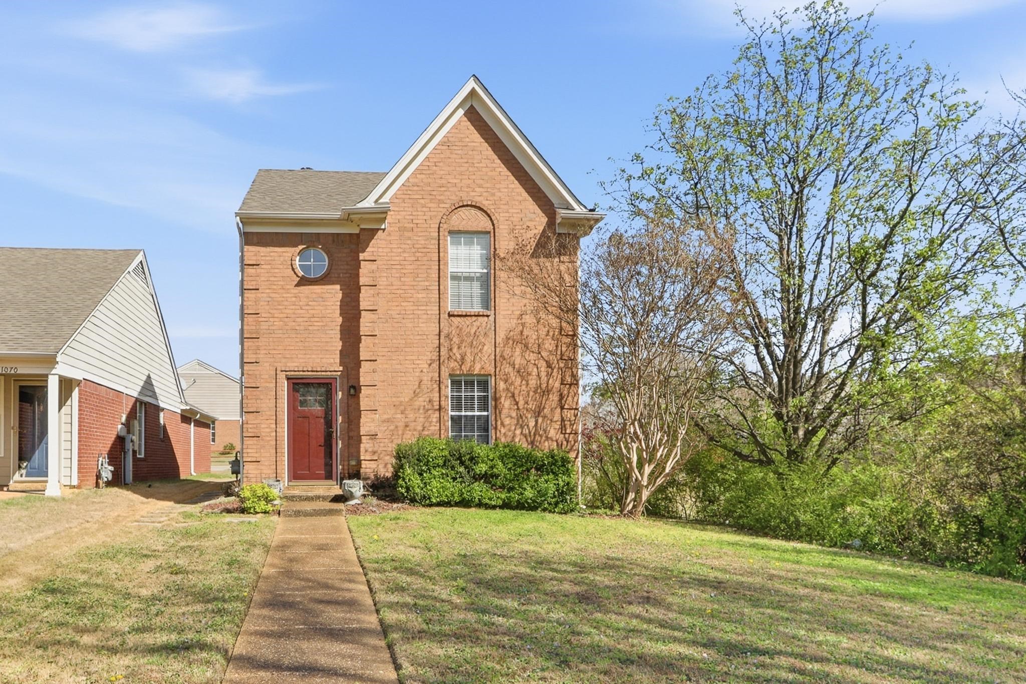 1066 Whitten Road Cordova, TN 38018 - Photo 2 of 30 a front view of a house with a yard