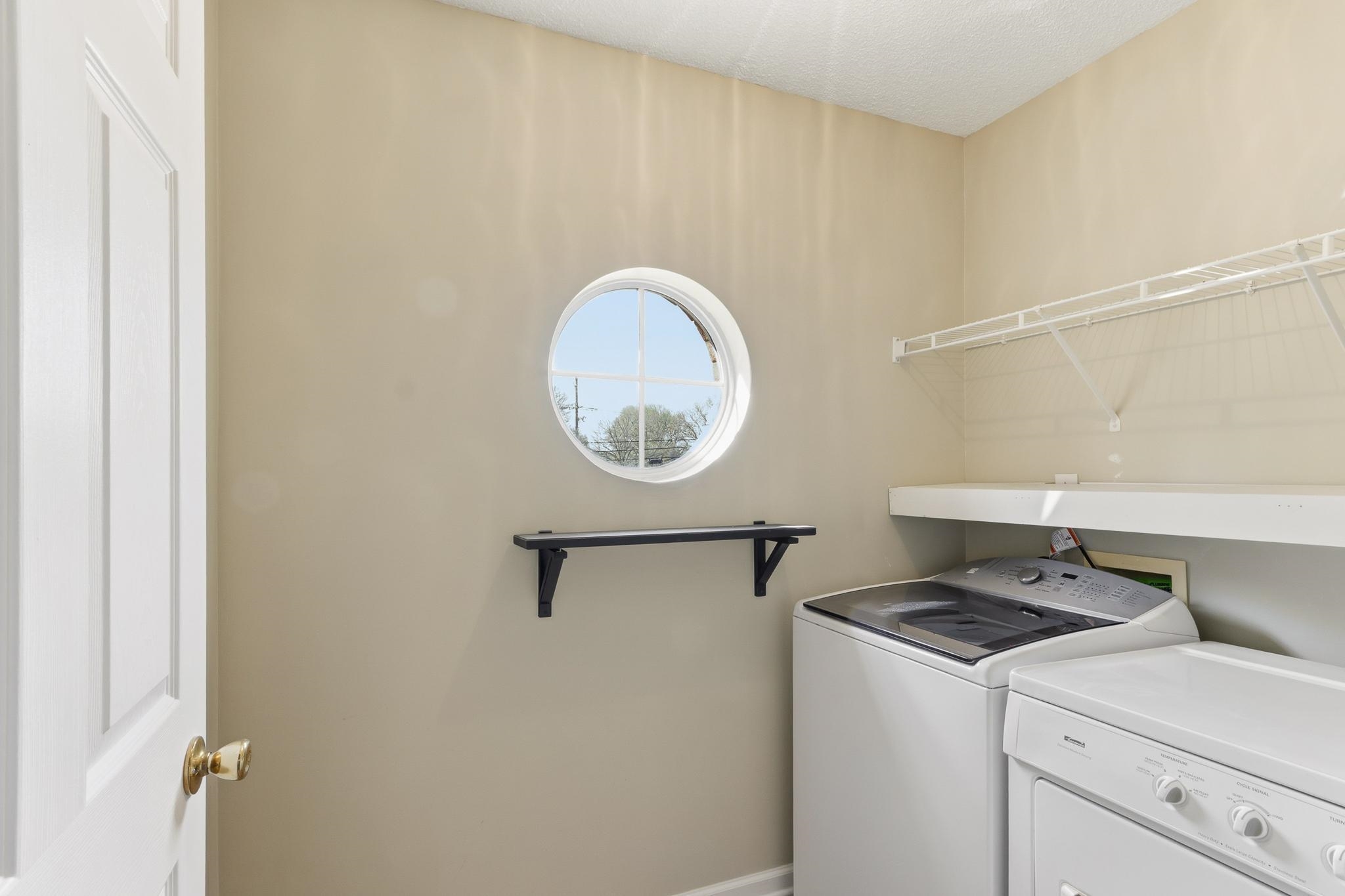 1066 Whitten Road Cordova, TN 38018 - Photo 23 of 30 a utility room with dryer and washer
