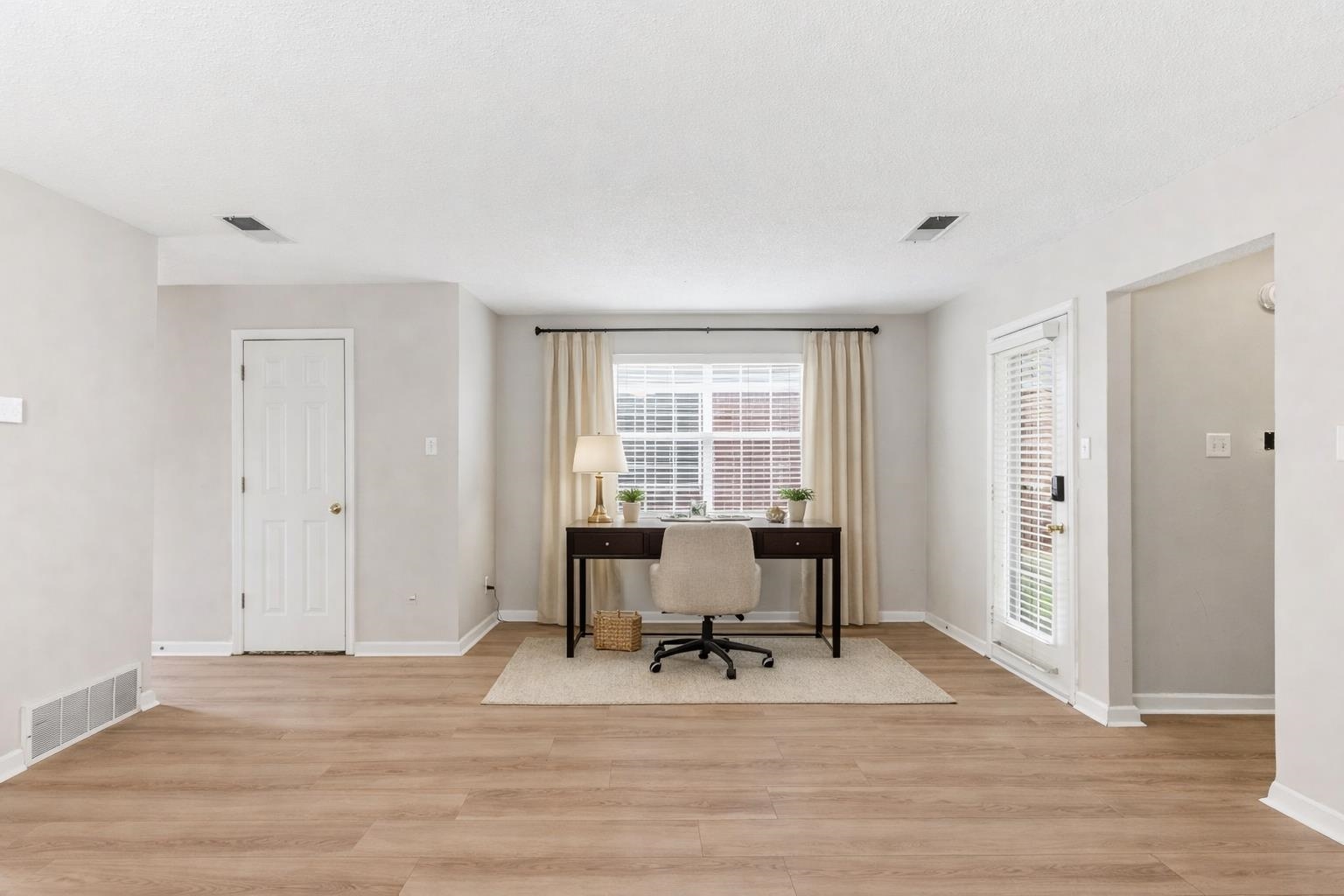 1066 Whitten Road Cordova, TN 38018 - Photo 4 of 30 a view of a livingroom with workspace and a window