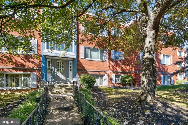 a view of a house with a tree