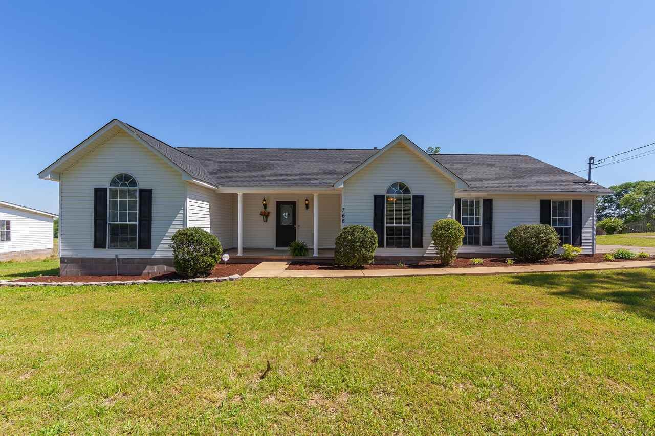766 Gobelet Road Medon, TN 38356 - Photo 1 of 1 a front view of house with yard and swimming pool