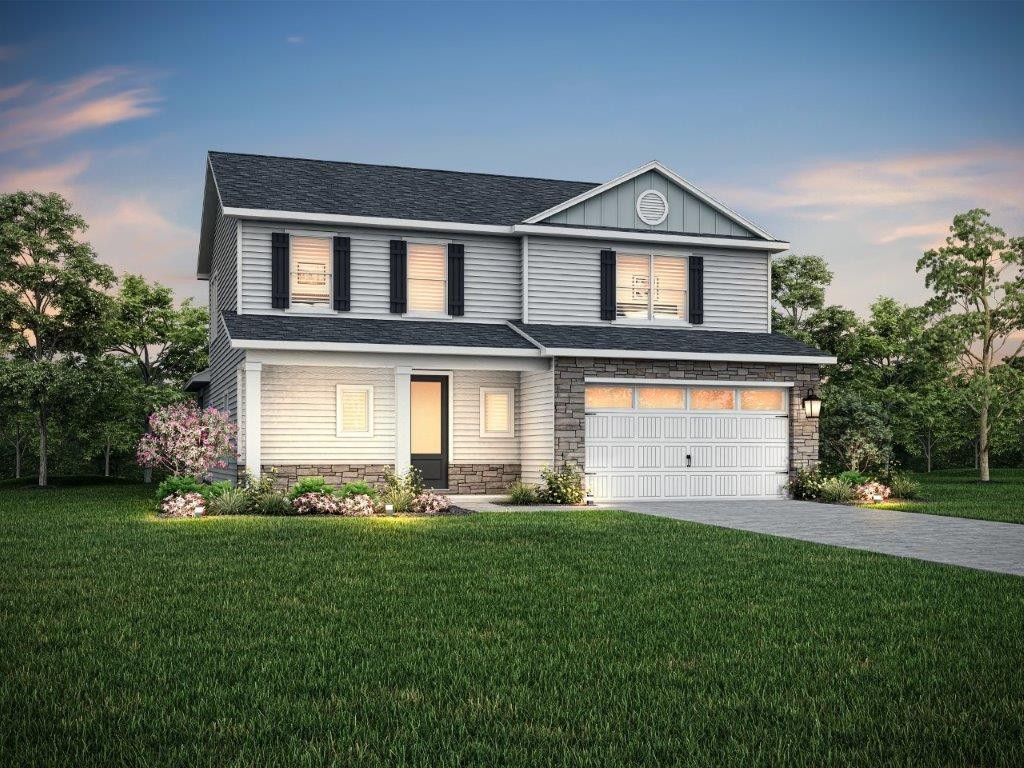 332 Springbrook Boulevard White House, TN 37188 - Photo 1 of 3 a front view of a house with a yard and garage
