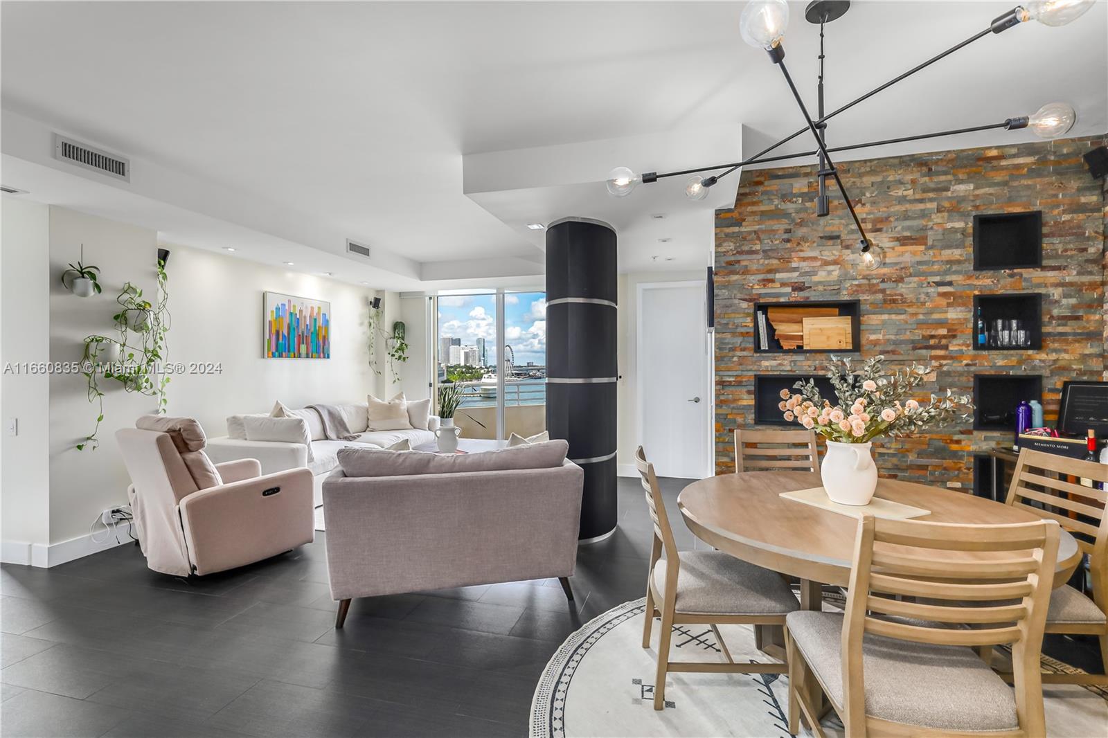 888 Brickell Key Drive, Unit 710 Miami, FL 33131 - Photo 21 of 45 a living room with furniture a flat screen tv and a fireplace