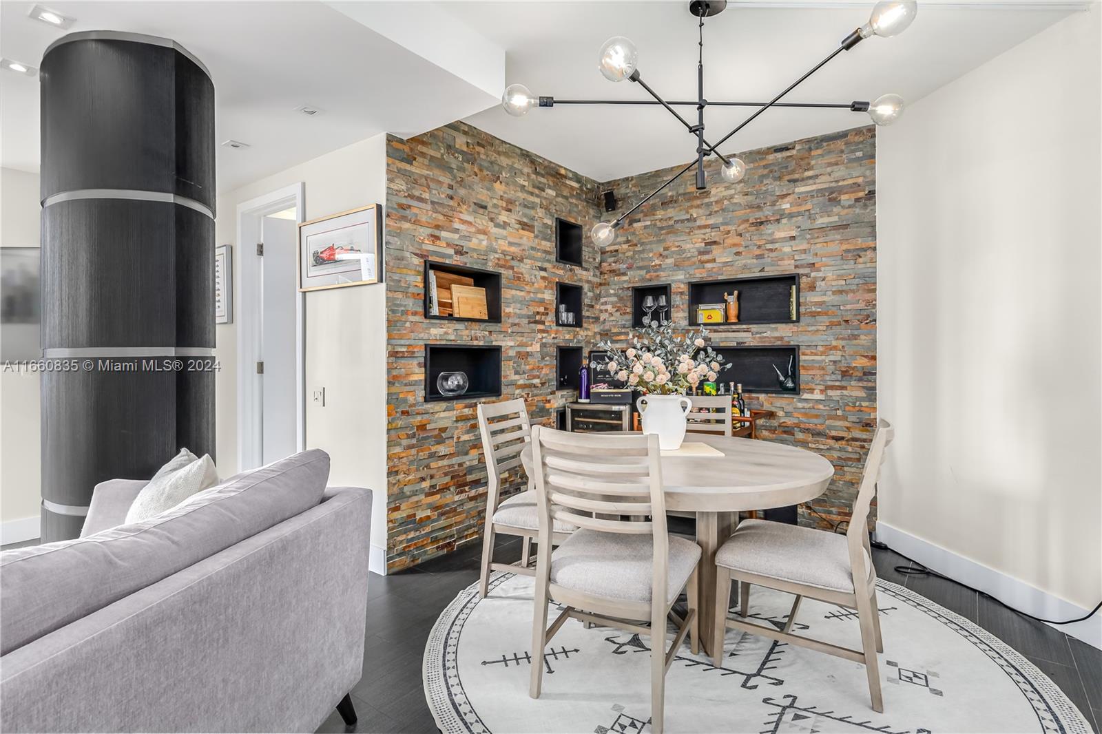 888 Brickell Key Drive, Unit 710 Miami, FL 33131 - Photo 22 of 45 a dining room with furniture and a fireplace