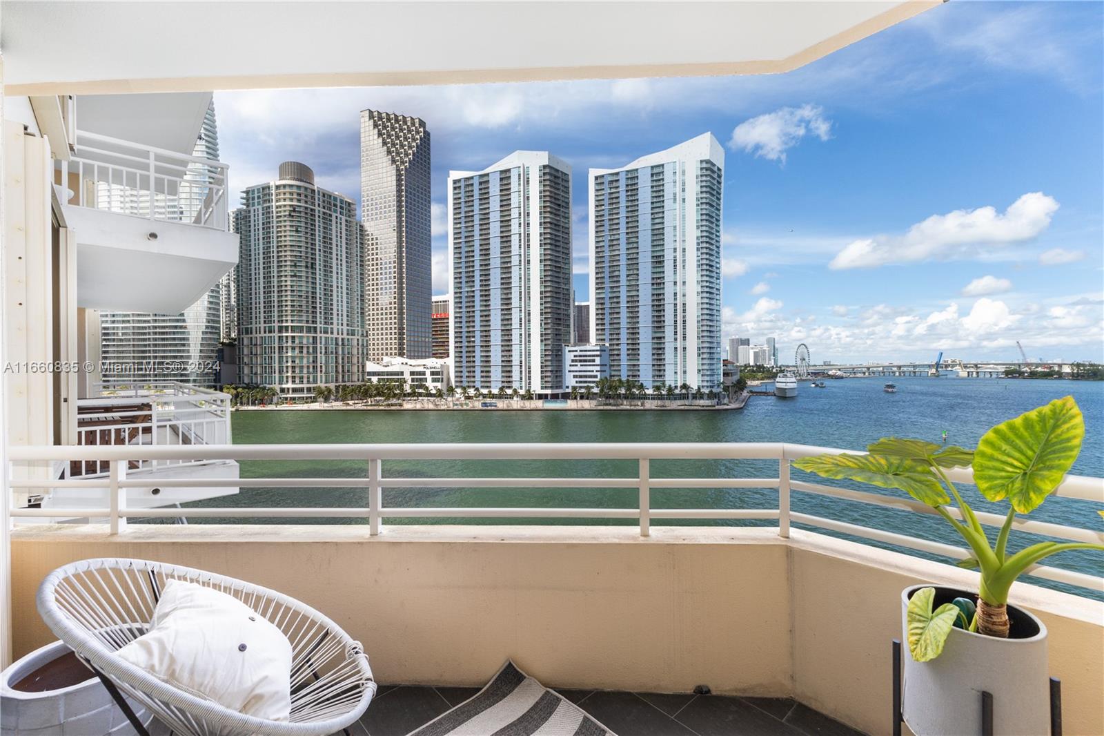 888 Brickell Key Drive, Unit 710 Miami, FL 33131 - Photo 9 of 45 a view of a swimming pool with a lounge chair
