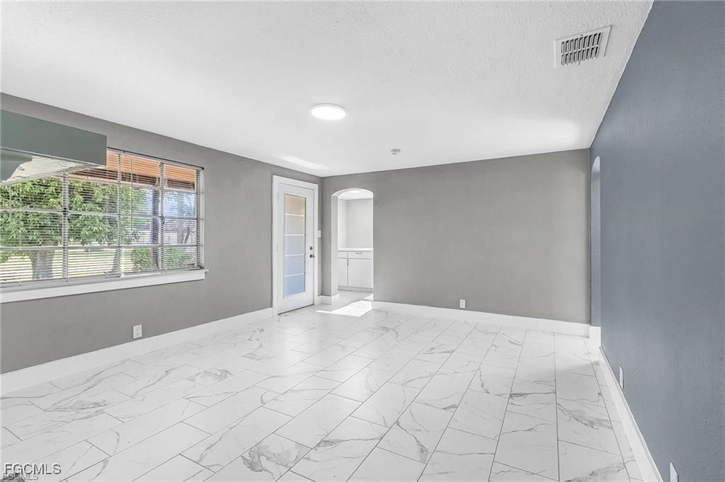 4472 East Riverside Drive Fort Myers, FL 33905 - Photo 2 of 17 a view of an empty room with a window