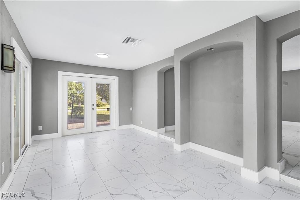 4472 East Riverside Drive Fort Myers, FL 33905 - Photo 6 of 17 a view of an empty room with window and cabinet